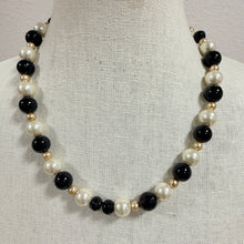 Load image into Gallery viewer, Vintage 1960s Black Cream Faux Pearl Glass Bead Necklace Silver Flower Box Clasp
