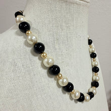 Load image into Gallery viewer, Vintage 1960s Black Cream Faux Pearl Glass Bead Necklace Silver Flower Box Clasp
