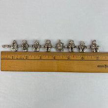Load image into Gallery viewer, Navajo Storyteller Sterling Silver Bracelet.  This impressive vintage Native American bracelet features eight intricate hand-carved sterling silver storytellers. Each marked Sterling with the Navajo artist Carol Felley maker&#39;s mark. Era: 1970s or5 earlier. Vintage Native American storyteller charm bracelet. Weight: 46 grams.
